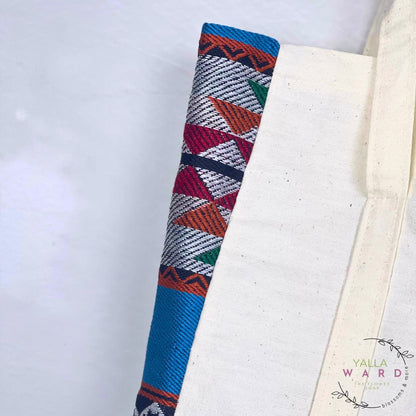 Colorful woven object on a white background with 'Yalla Ward' branding.