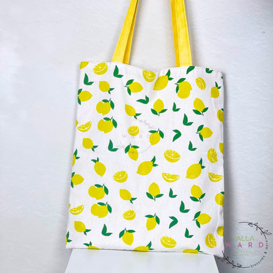 Tote bag with lemon pattern on a white background