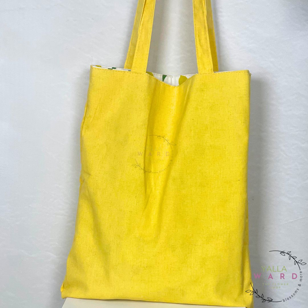 Yellow tote bag on a white background