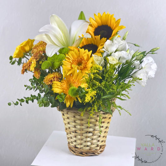 flowers in a woven basket on a white background