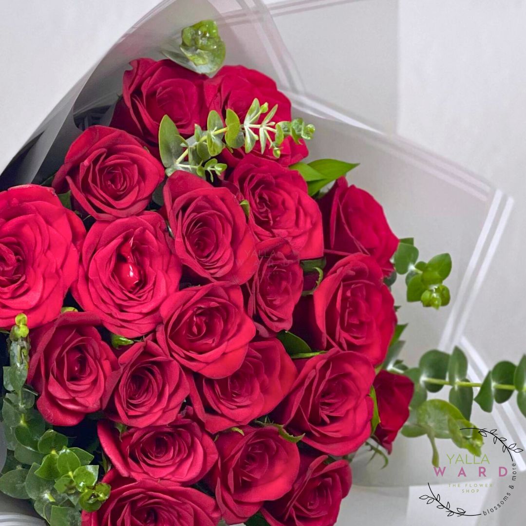 Bouquet of red roses with green leaves , featuring the brand 'Yalla Ward'.