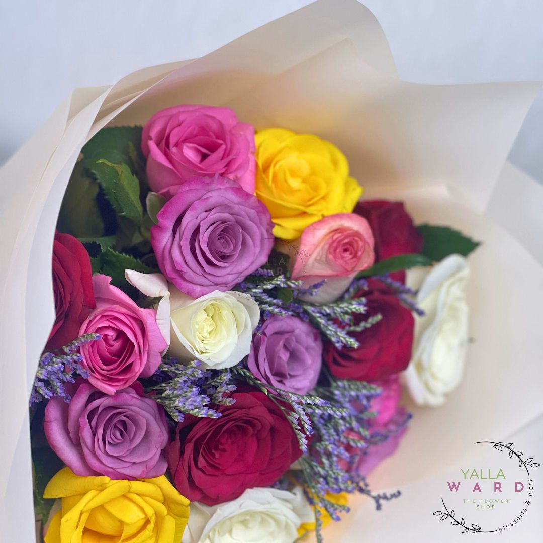 Bouquet of colorful roses with a visible brand logo on a white background
