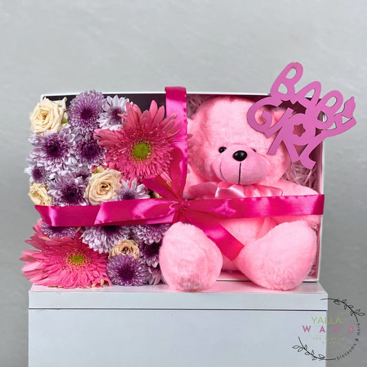 Gift set with pink teddy bear and flowers in a box, featuring a 'Baby Girl' banner.