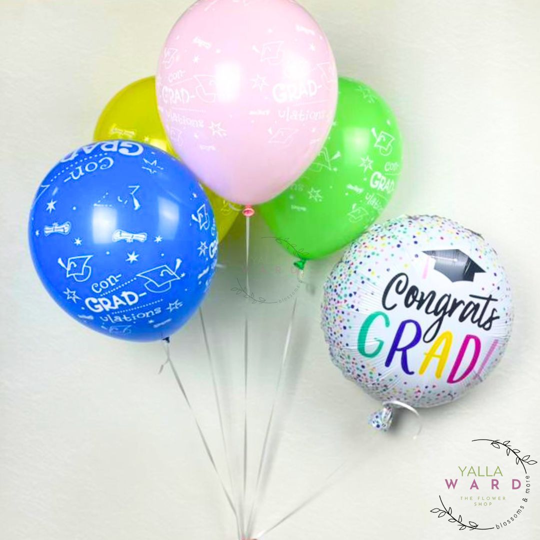 Graduation-themed balloons with 'Congrats Grad' text on a white background