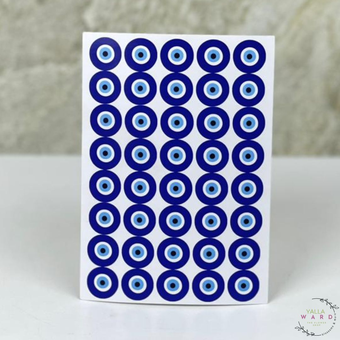 Sheet of blue and white circular stickers on a white card with a blurred background