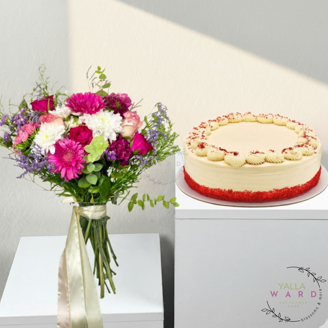 Bouquet of flowers and a cake on a white surface with 'Yalla Ward' branding.