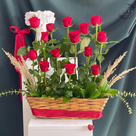 Basket of red roses with a decorative bow on a dark background